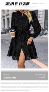 Close-up of black long sleeve dress featuring intricate 3D floral embroidery and lace texture