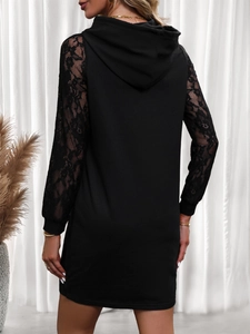 Detail of elegant black lace patchwork on long sleeves of a slim hooded dress