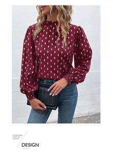 Detail of burgundy long sleeve blouse with gold rhombus print and ruffled high neck collar