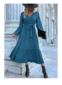 Close-up of deep teal V-neck dress featuring button details and a matching waist tie