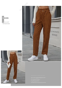 Detail of high-waist brown corduroy straight-leg pants with elastic waist and button