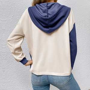 Detail of waffle knit fabric and color-block design on the back of this women's hoodie