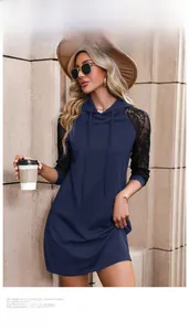 Detail of lace patchwork sleeves on a navy long-sleeve hooded dress for women