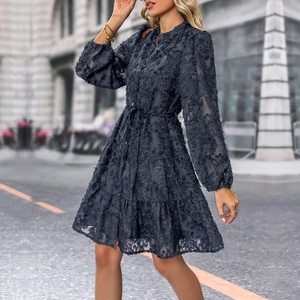 Detail of dark blue dress featuring 3D feather jacquard texture and drawstring waist
