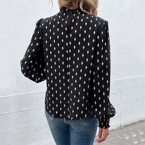 Women's black long sleeve shirt with gold diamond print and pleated high neck back view