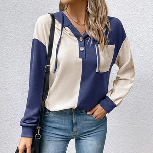 Detail of waffle knit fabric and color-block design on women's casual hoodie with pocket