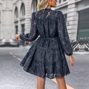 Detailed back view of dark blue long sleeve mini dress with 3D floral jacquard texture