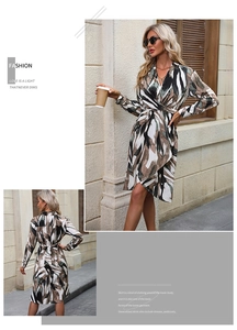 Detail view of floral print wrap dress featuring deep V-neck and stylish waist tie knot