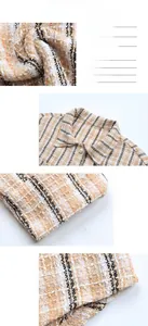 Dettaglio macro della trama in tweed con elegante bottone a perla e raffinati motivi tessuti
