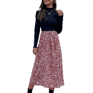 Women's A-line dress with long puff sleeves and red white abstract spiral pattern