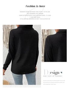 Detail view of black ribbed knit sweater featuring a high cowl neck and slim fit design