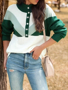 Detail of multi-color block knit sweater with button mock neck and V-stripe pattern