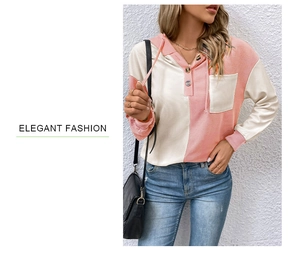 Detail of color-block hooded sweatshirt with waffle texture and button neckline