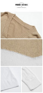 Détail du pull en maille à col en V avec blocs de couleurs et finitions côtelées