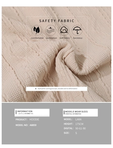 Close-up of beige knit hoodie showing thick twisted texture and soft breathable fabric