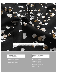 Dettaglio della stampa floreale su abito nero autunnale che mostra texture e materiale