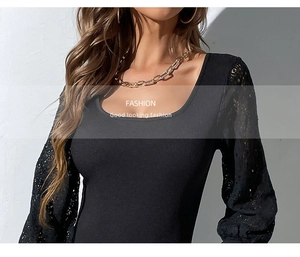 Close-up of black slim fit bodysuit with square neck and hollow lace patchwork sleeves