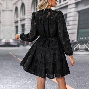 Elegant black lace long sleeve mini dress with tiered skirt and lantern sleeves back view