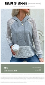 Détail d'un sweat à capuche gris avec dentelle blanche sur les manches et la poche
