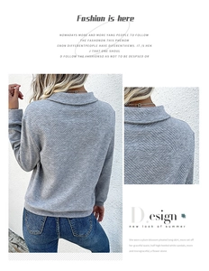 Detail of grey textured sweatshirt with diamond pattern fabric and stylish stand collar