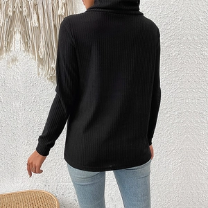 Women's black ribbed knit turtleneck sweater with long sleeves shown from the back view