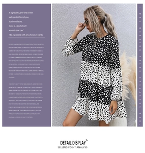 Detailansicht des langärmeligen Polka-Dot-Kleides mit gestuftem Rüschenrock-Design