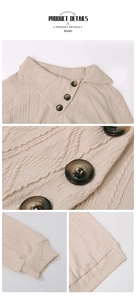 Detail of apricot knit sweater with asymmetrical collar, textured pattern and amber buttons