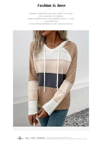 Close-up of hollow knit texture and multi-color patchwork on women's hooded sweater