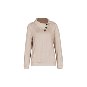 Detail of beige cable knit sweater featuring asymmetric lapel collar and wooden buttons