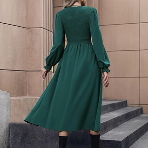 Dark green smocked back midi dress with elegant long lantern sleeves and flowing skirt