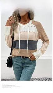 Detail of color-block hooded knit sweater with breathable eyelet texture and white drawstring