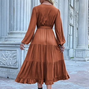 Long sleeve V-neck tiered maxi dress with waist tie shown on a model from behind