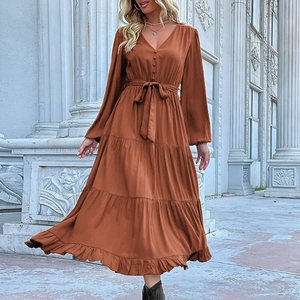 Elegant V-neck long sleeve tiered maxi dress in rust brown with a waist tie belt