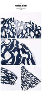 Détail de robe bleue imprimée géométrique avec col en V et manches bouffantes sur blanc