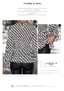 Detail of the ruffled collar and smocked waist on a black and white wavy striped shirt