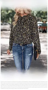 Close-up of leopard print chiffon shirt with fashionable bow neck tie detail