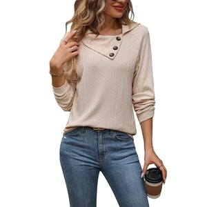 Women's cream knit sweater with asymmetrical button collar and vertical texture