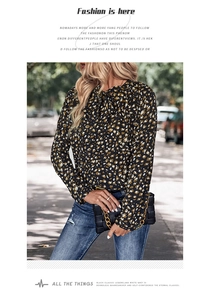 Detail of leopard print blouse with elegant bow-tie neck and stylish gold chain handbag