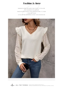 Detail of V-neck ruffled shoulder design with quilted texture and lace sleeves