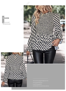 Detail of smocked high neck and waist on a black and white wavy pattern blouse