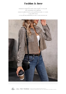 Close-up of brown and white houndstooth pattern on a vintage cropped jacket for women