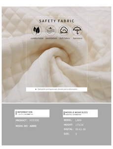 Macro shot of white diamond quilted hoodie fabric with detailed size and model information