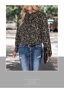 Detail of leopard print long-sleeve blouse featuring a decorative neck tie bow design