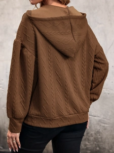 Detailed back view of brown knit hoodie showing diamond jacquard texture and drop shoulder