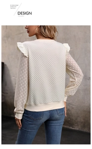 Detail of ruffle shoulder and hollow lace sleeve on cream quilted long sleeve top