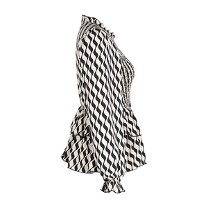 Detail of smocked chest and black white wave pattern on elegant peplum blouse