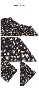Detail view of leopard print shirt featuring navy blue fabric with buttoned cuffs