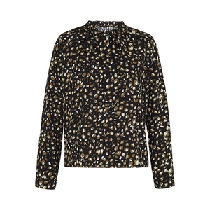 Close-up detail of leopard print pattern and pussy bow neckline on long sleeve shirt