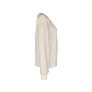 Detail view of cream quilted sweatshirt featuring crochet lace sleeves and ruffle shoulders