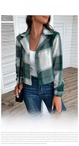 Detailed view of green and white plaid lapel jacket with double button closure